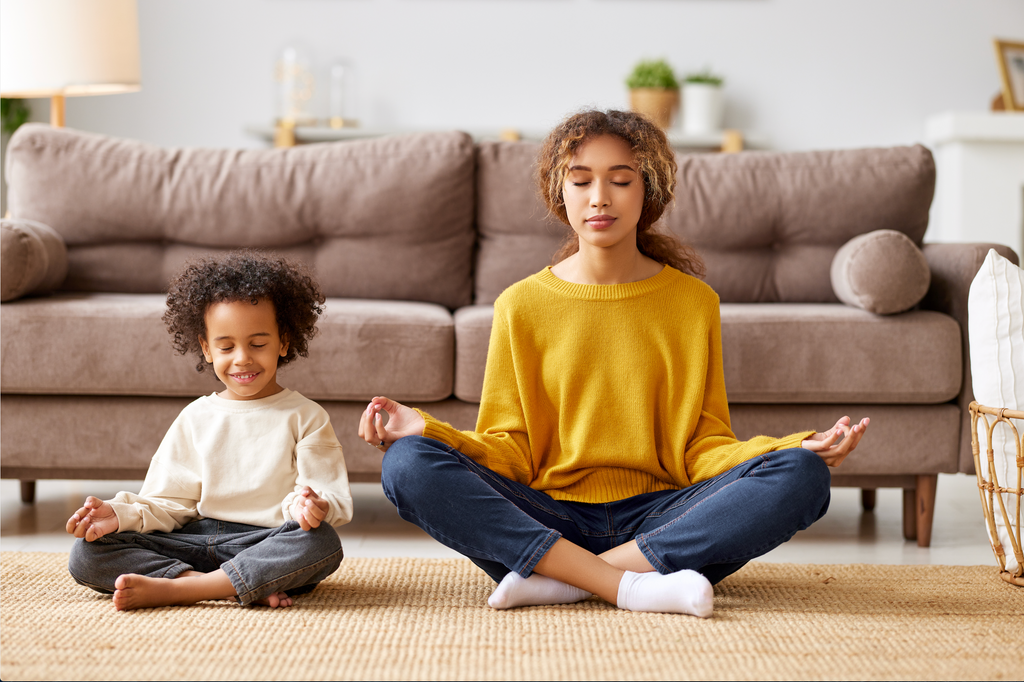 Mom meditating with child