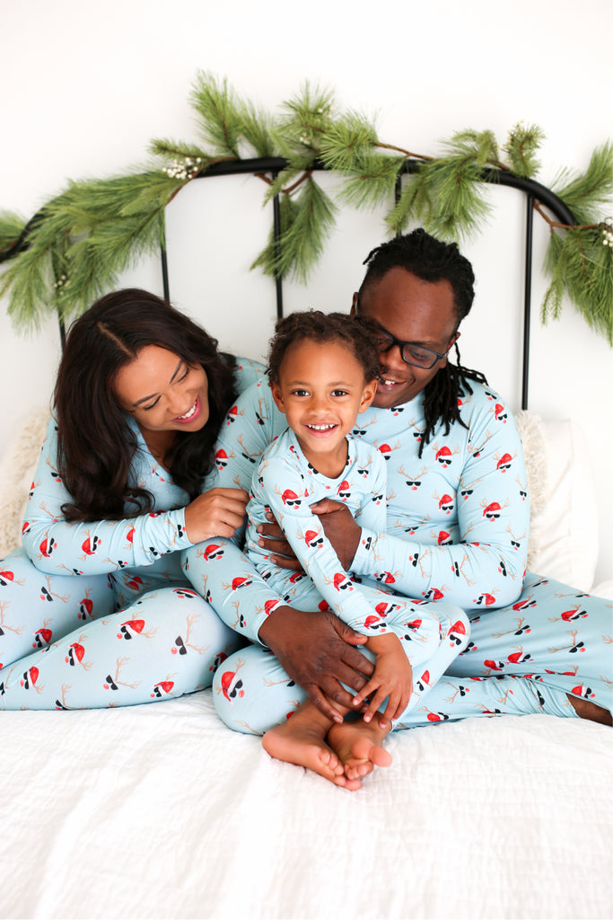 family wearing matching holiday pajama sets