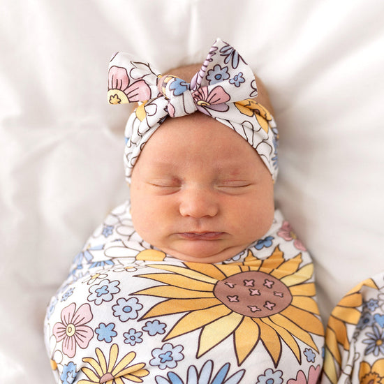 Baby sleeping in eye swaddle