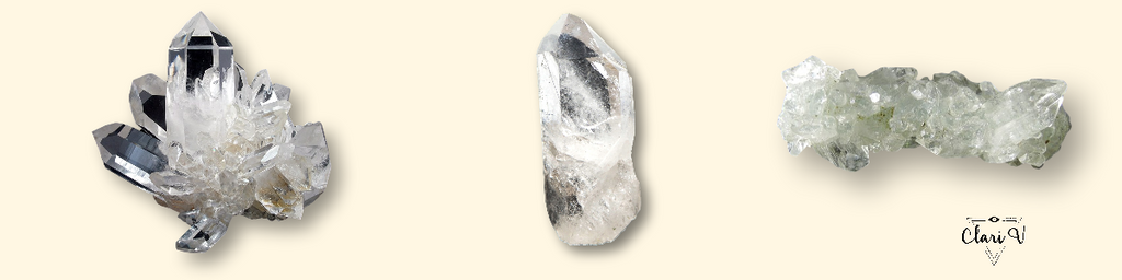Three clear quartz crystals on display