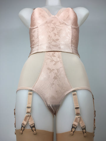 faux vintage 1950s lingerie by pip and pantalaimon. Vintage peachy satin longline bra, inspired by bullet bras, pairs with high waisted pantie girdle knickers with 6 detachable suspender straps with our signature split Y strap, 12 garter clips keep your seamed stockings in place all day