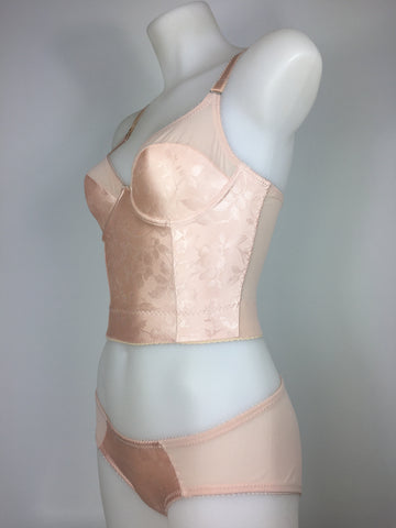 faux vintage 1950s lingerie by pip and pantalaimon. Vintage peachy satin longline bra, inspired by bullet bras, pairs with high waisted pantie girdle knickers with 6 detachable suspender straps with our signature split Y strap, 12 garter clips keep your seamed stockings in place all day