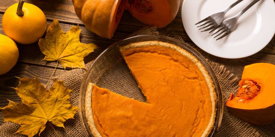 Pumpkin pie and fresh pumpkins