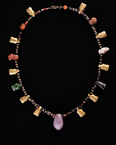 Figure 7: Ten small, gold scarabs decorate this necklace, which is interspersed with amulets made from other semi-precious stones (15.JW.399).