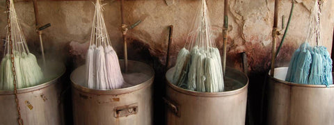 Knitting wool hanging in dying pots