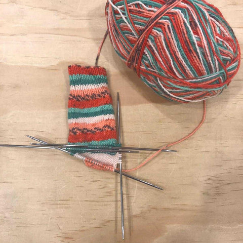 Double pointed needle technique for knitting socks