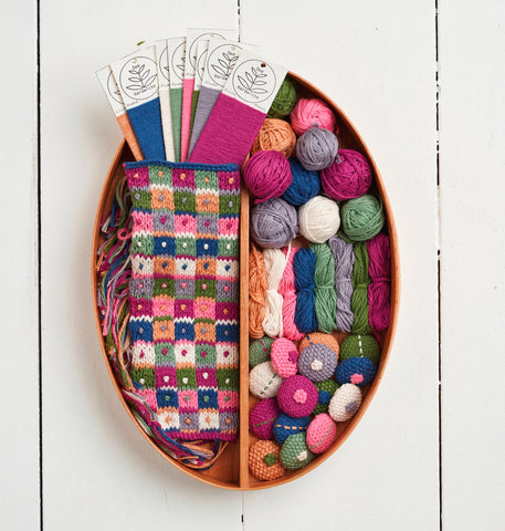 Basket of knitted swatches and covered buttons