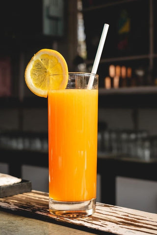 orange juice in a tall glass
