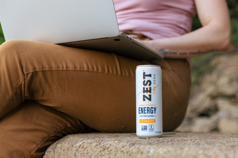 woman working outdoors with Zest energy tea