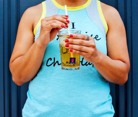 person holding a cup of iced Zest Tea