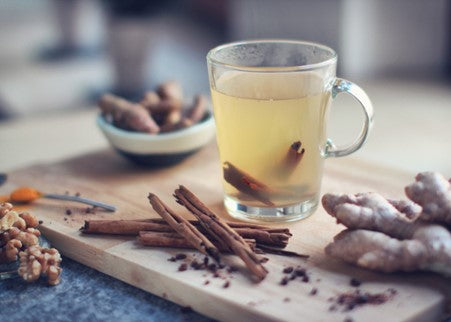 ginger cinnamon tea in a glass teacup