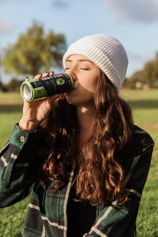 woman drinking zest green energy tea