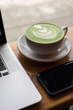 matcha tea latte at a desk