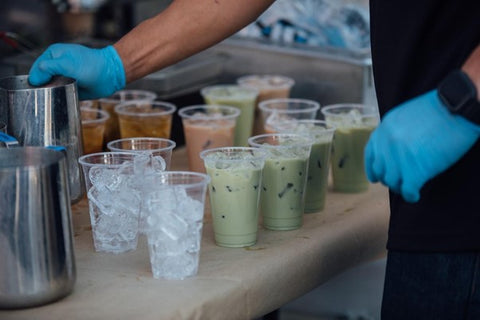 iced matcha latte in plastic cups