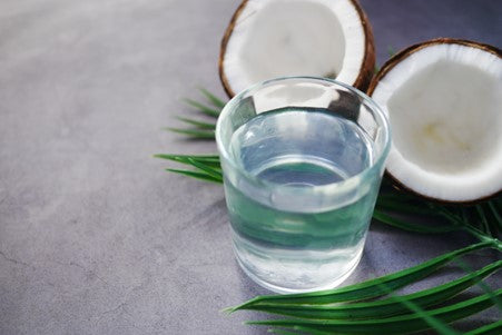 coconut water with a split coconut