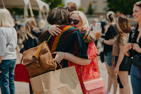 Photo: two people embracing at Vintage Fest