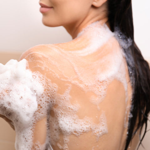 person using body soap