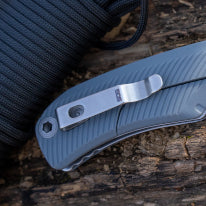 A robust SOG Tellus FLK - Wolf Gray folding knife featuring a durable ambidextrous GRN handle and a sturdy CRYO 440 stainless steel blade, perfect for outdoor adventures.