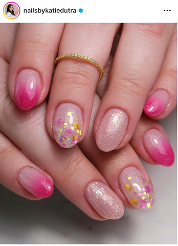 Instagram post of eight fingers, each with pink glitter ombre nail designs.