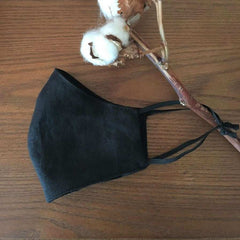 Linen Face Mask Hanging From A Cotton Branch