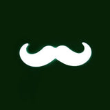 A white moustache on a green background