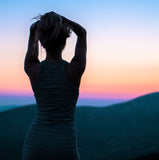 A woman watching a sunset