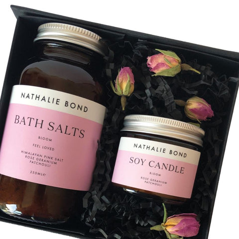 Bath salts and a soy wax candle in a black gift box