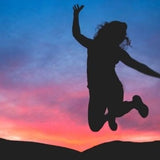 A woman jumping into the air