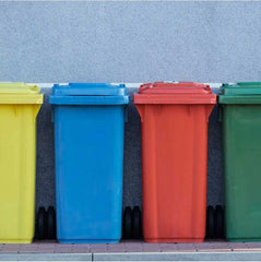 A yellow, blue, red and green recycling bin