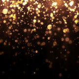 Gold confetti on a black background