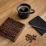 A wooden sudoku on a table top