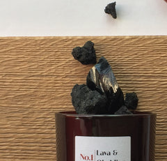 Natural Lava & Obsidian rocks spilling out of a jar