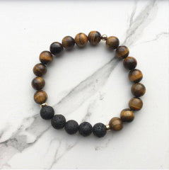 Tigers eye diffuser bracelet on a white marble surface