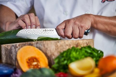 Cutting cucumber with Kizaru Kanji kitchen chef knife