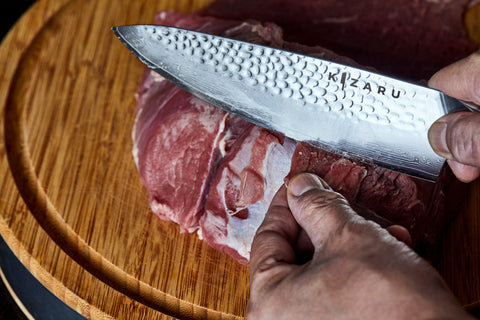 Cutting raw meat with Kizaru Kanji kitchen chef knife