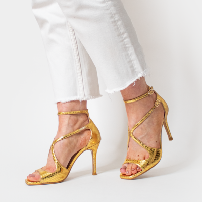 Woman wearing gold Lodi sandals with high heel | Lodi Shoes