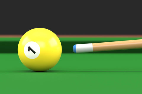 Close-up of billiard ball number one yellow color on billiard table.