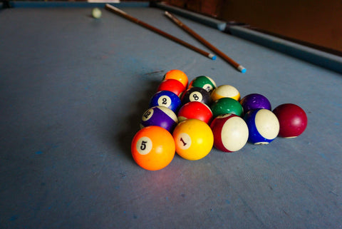 Close-up view of a used and old pool table