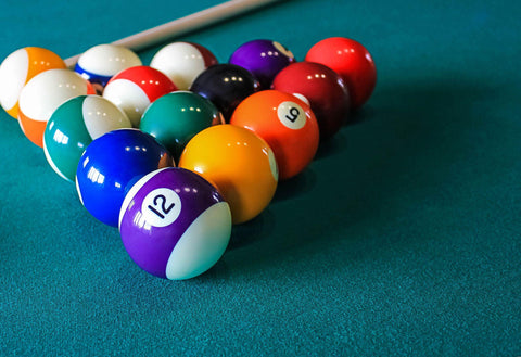 Colored Billiard Balls on green table background. Concept of Billiard game.