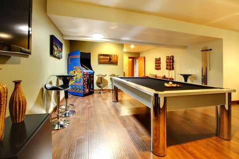 Home game room with pool table and arcade machine