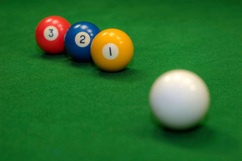 numbers one, two and three pool balls in a row