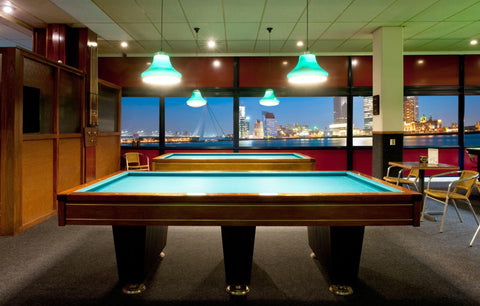 Retro pool room with carom tables.