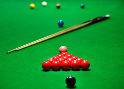 Snooker balls set on a green table