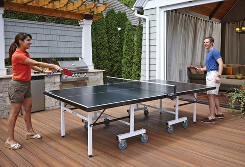 Two people playing ping pong on Blatt Billiards ping pong table.