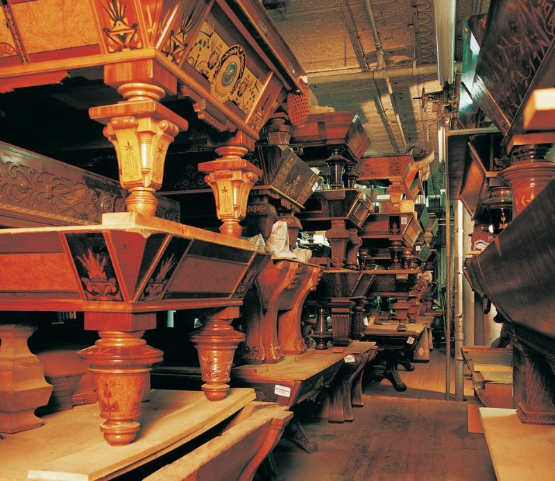 stacks of antique pool tables