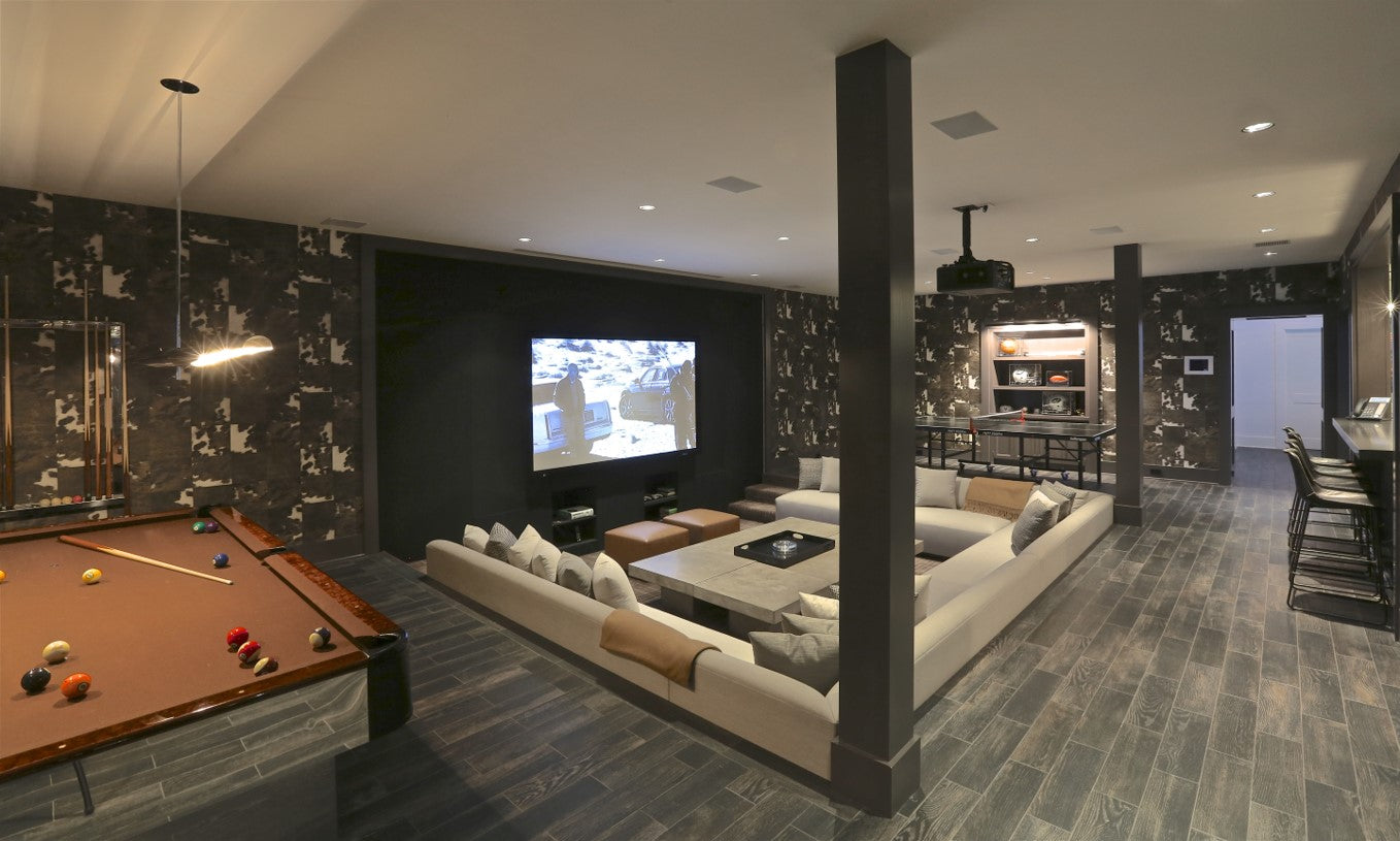 game room with sunken couch