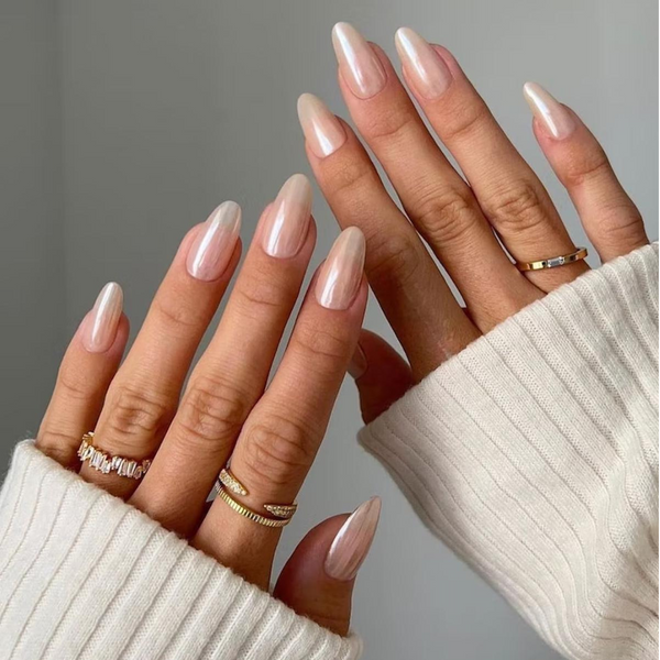 long almond light pink glazed donut nails with gold rings