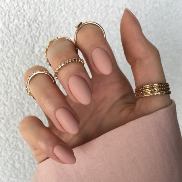 short round matte nude nails with gold rings