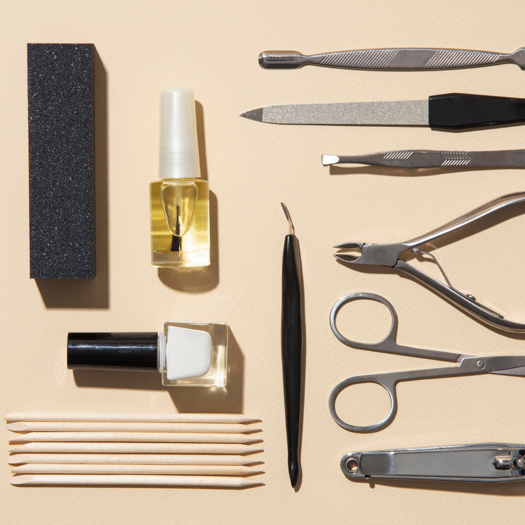nail care kit including cuticle oil, cuticle stick, nail buffer, and nail clippers