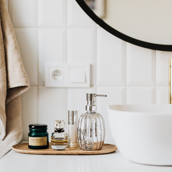 bathroom vanity tray next to sink with hand care items